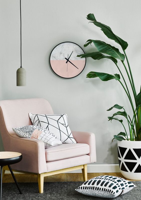 cozy reading nook with the prettiest of millennial pink accent chairs