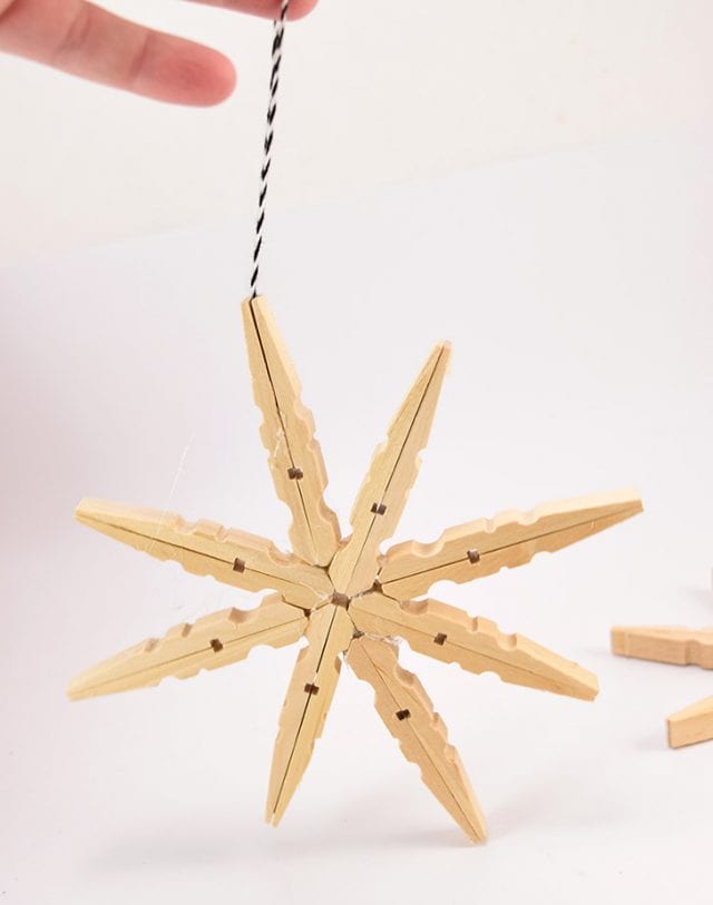 DIY Glitter Clothespin Snowflakes Craft